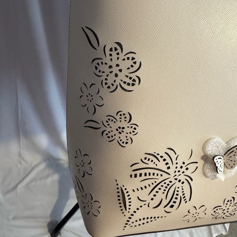 kate spade Cream Tote with Decorative Cutouts and Scarf Accent